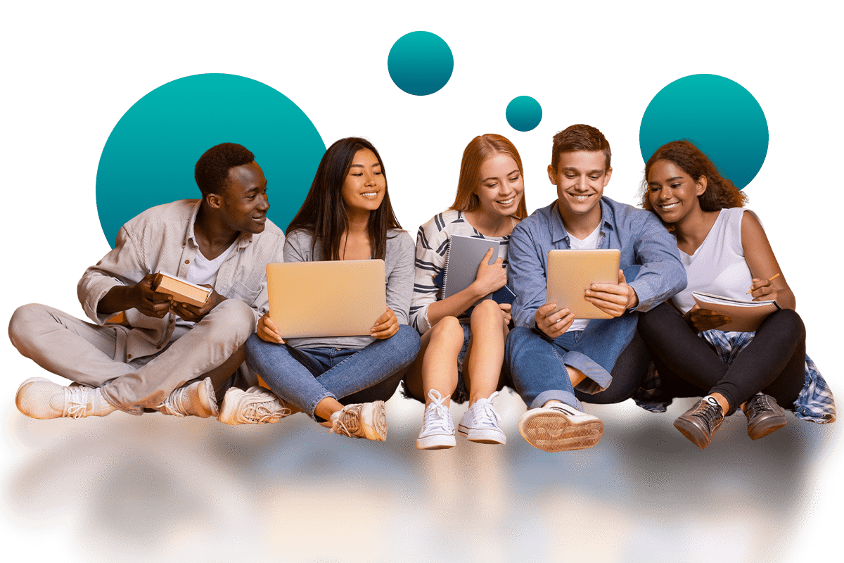 Five diverse students sitting on the floor in a semi-circle, smiling and engaging with books, laptops, and tablets.