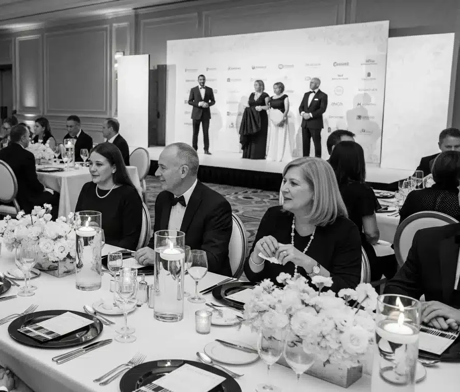 Black and white themed fundraising gala with guests in formal attire